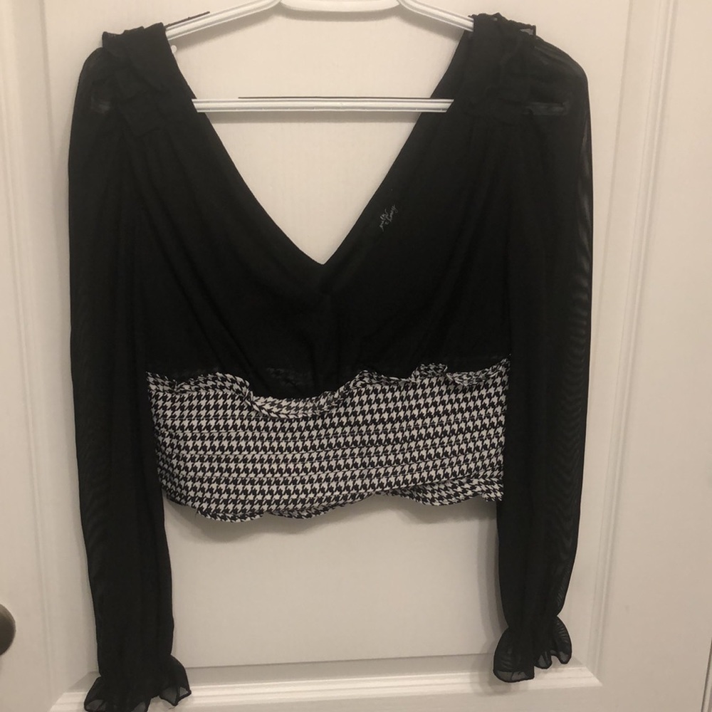 Womens Size S. New but I no longer have the tag. Never worn. Sheer material.